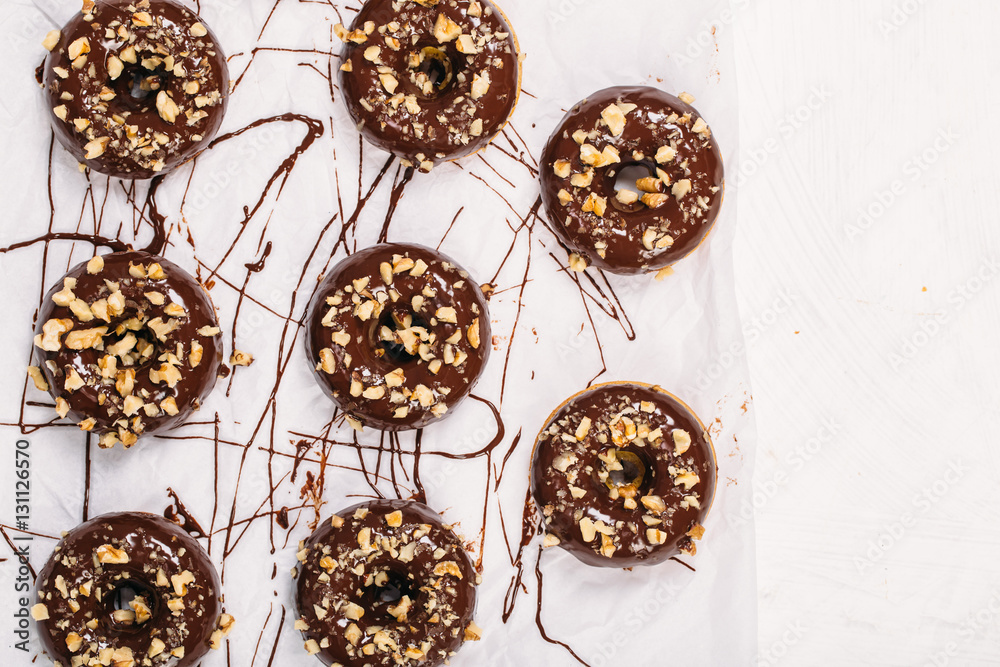 Fresh baked gluten free chocolate donuts and bowl with glaze