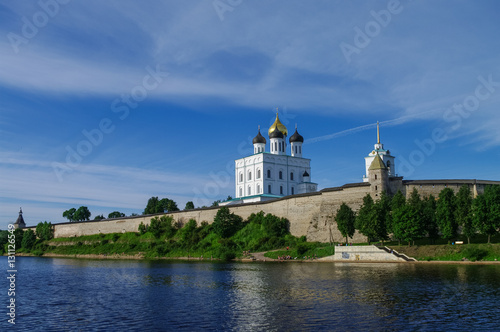 Panorama view from Volhov river of Trinity Cathedral, the bell tower and the walls and tower of Pskov Kremlin. Pskov, Russia