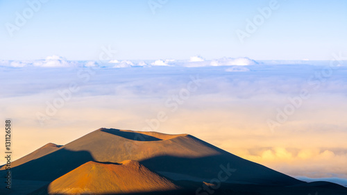 View of Volcano craters from Mauna Kea Mountain summit at sunset