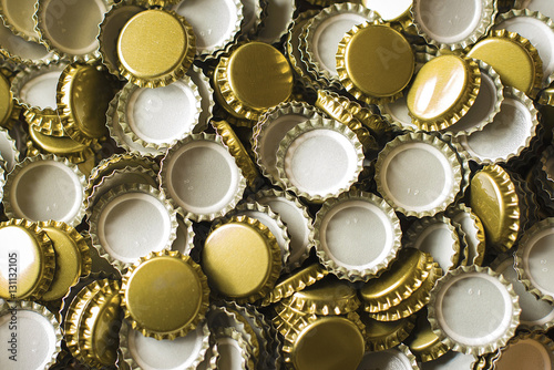 Gold coloured bottle caps, full frame  photo