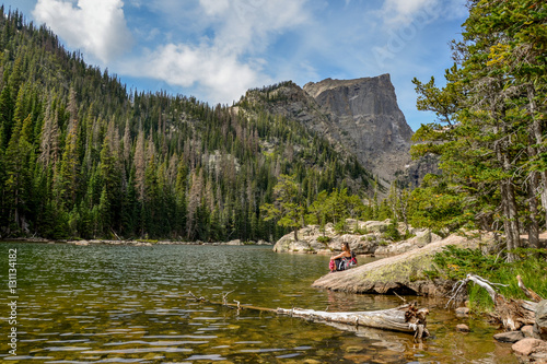 female hiker sitting on the banks of Dream Lake with Hallett peak in the background
Rocky Mountain National Park, Estes Park, Colorado, United States photo