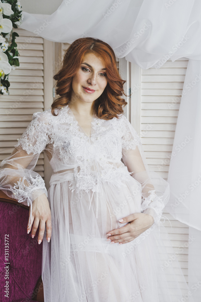 Portrait of a redhead girl in a transparent negligee 6830. Portrait of a redhead girl in a transparent negligee 6830.