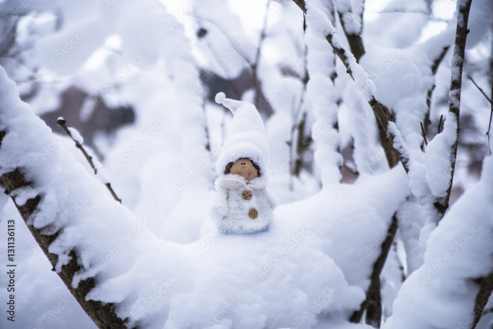 Snow fairy gnome in the forest
