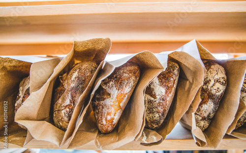 Whole loaves in brown paper bags 