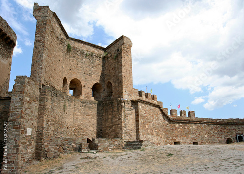 The reconstructed stony wall and the fragment of the tower in the medieval Genoese fortress Soldaia in Sudak, Crimea.   