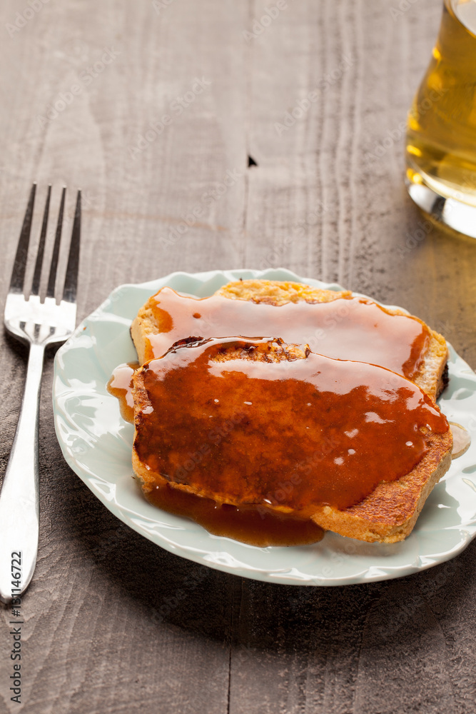 Whole wheat French Toast topped with cinnamon apple spiced syrup with apple juice Whole wheat French Toast topped with cinnamon apple spiced syrup with apple juice