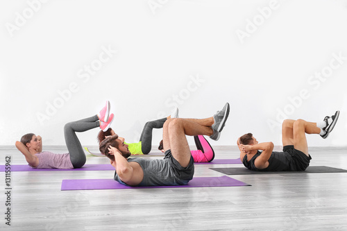 Group of people doing yoga ...