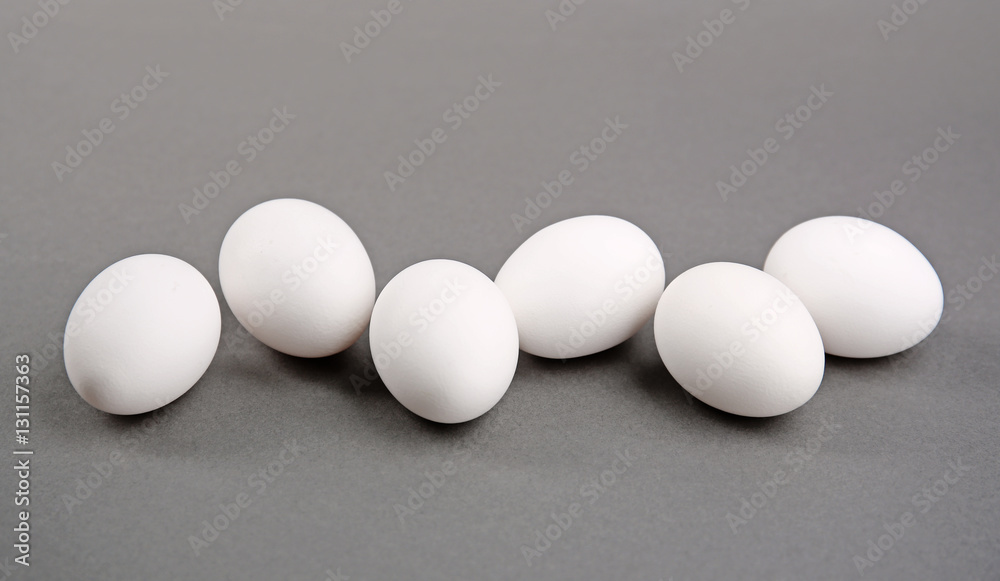 White eggs on grey background White eggs on grey background
