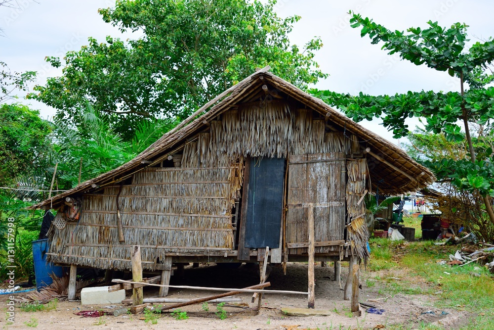the hut in small fisherman village near the beach .small grass house next to the sea the hut in small fisherman village near the beach .small grass house next to the sea