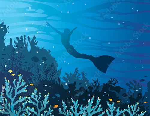 Coral reef with fish and freediver on a sea.