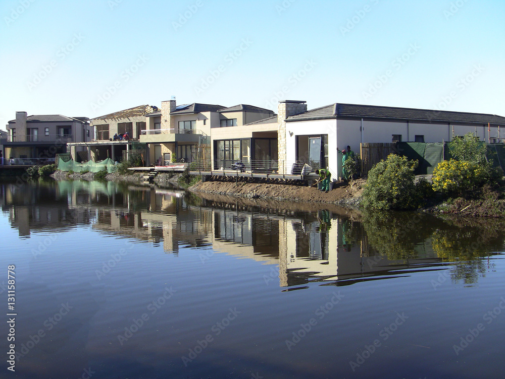 House reflected in water at Century Cirty, Cape Town, South Africa