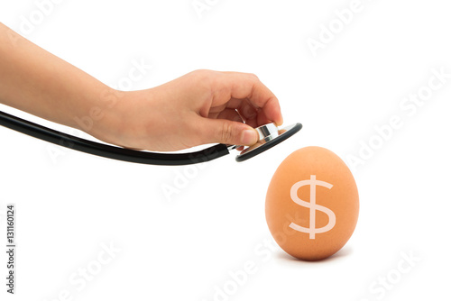 Checking For A Healthy Egg, Egg with Stethoscope with white back photo