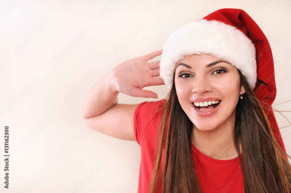 beautiful young woman in Santa hat exciting about Christmas holiday beautiful young woman in Santa hat exciting about Christmas holiday
