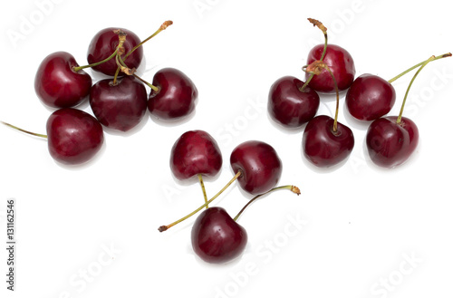 red cherries on a white background © studybos