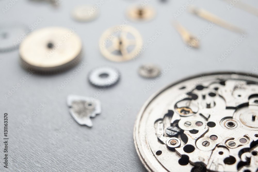 Detail of watch machinery on the table. Detail of watch machinery on the table.