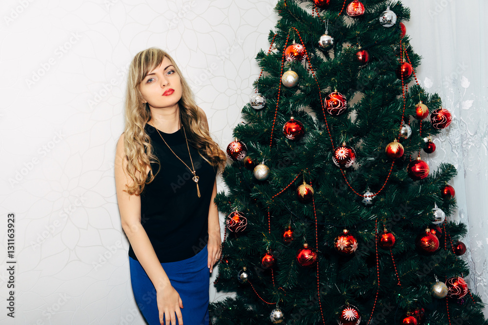Beautiful blonde near a Christmas tree. Beautiful blonde near a Christmas tree.