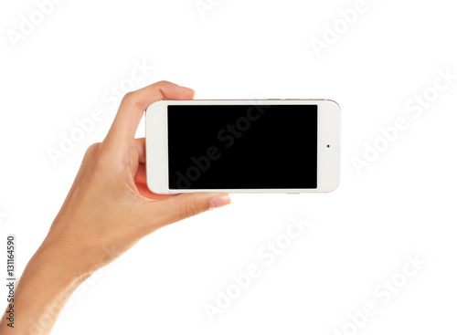 Female hand holding cellphone, isolated on white