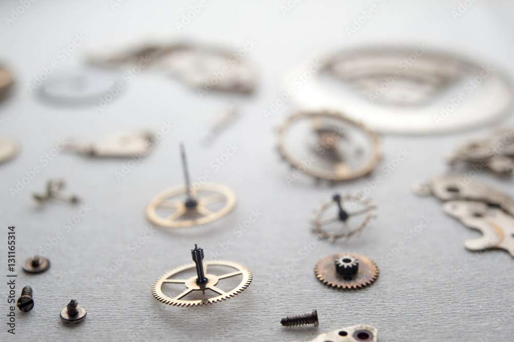Detail of watch machinery on the table. Detail of watch machinery on the table.