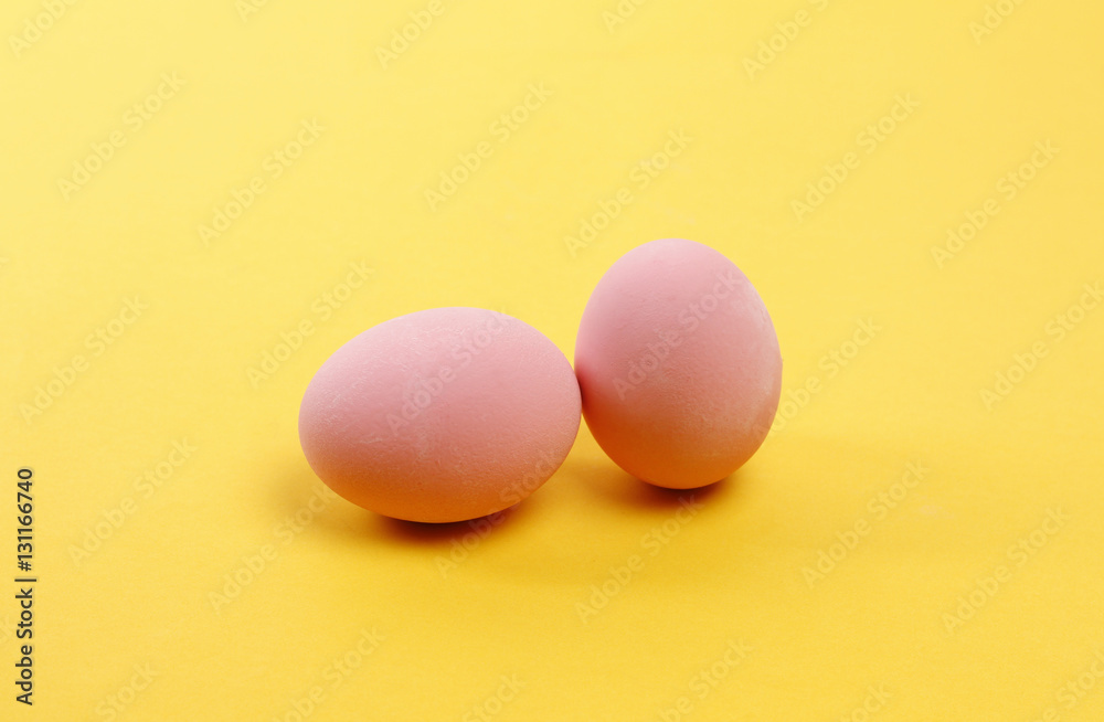 Preserved egg on yellow background, Asian Traditional Food, pink Preserved egg on yellow background, Asian Traditional Food, pink