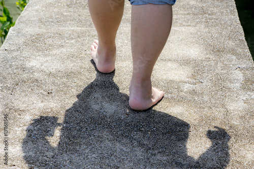 man barefoot walking on the floor