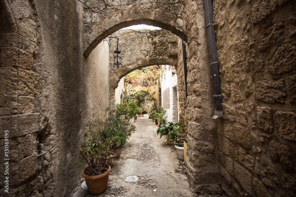 Medieval arched street in the old town of Rhodes, Greece