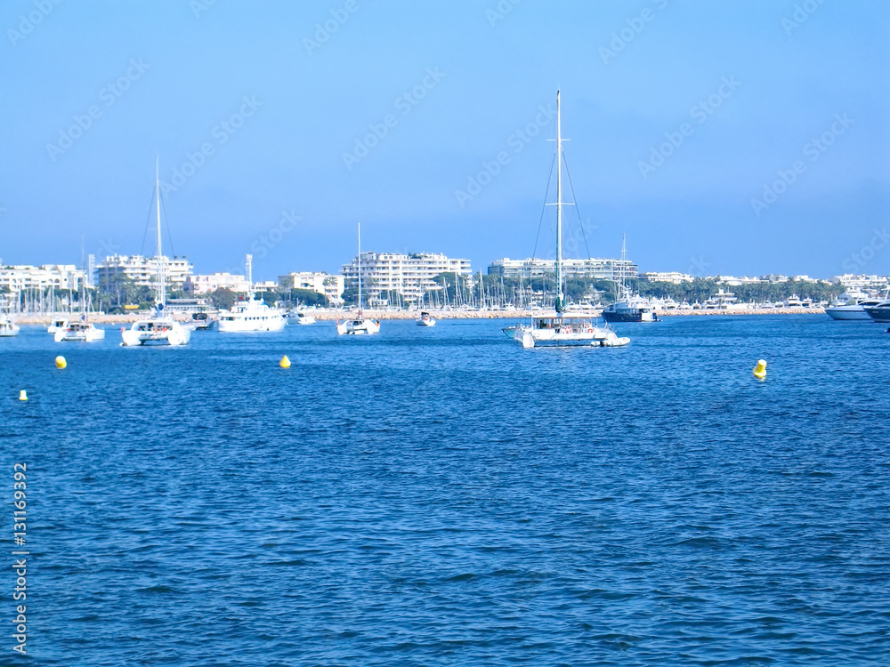 Sailboats, yacht and buildings