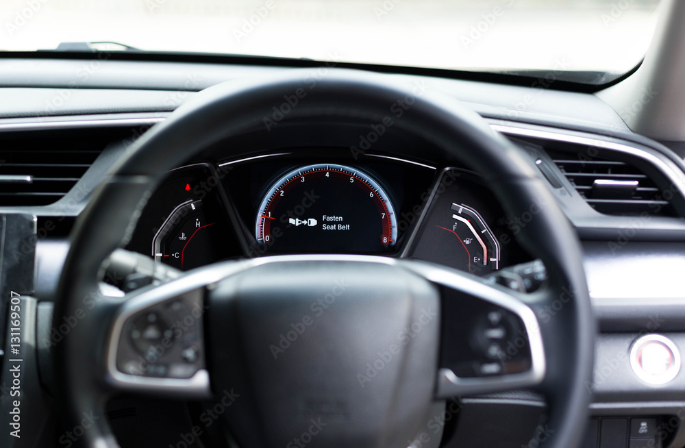 Fasten seat belt warning sign on car dashboard information for s