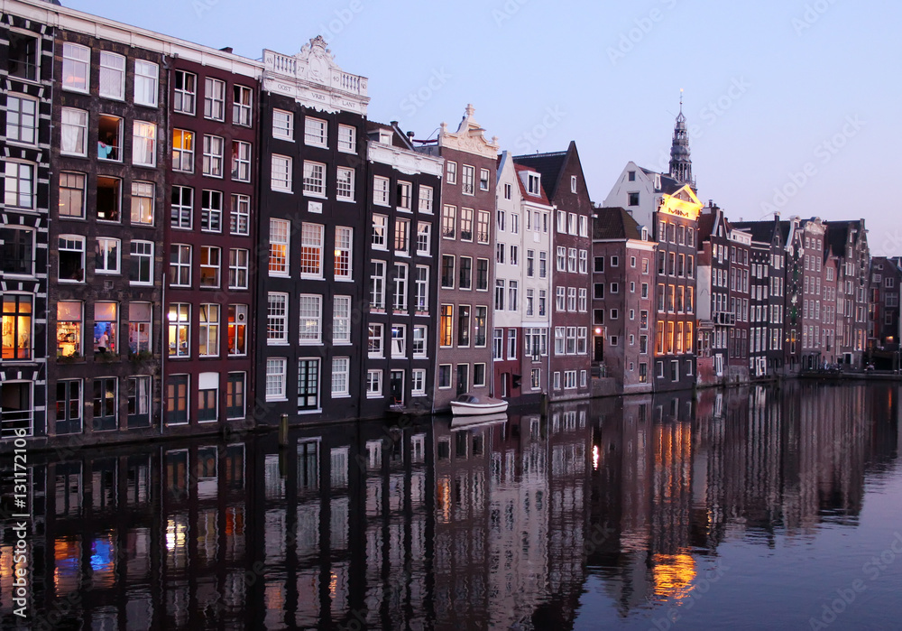 The Damrak canal, running between Amsterdam Centraal in the north and Dam Square, Holland