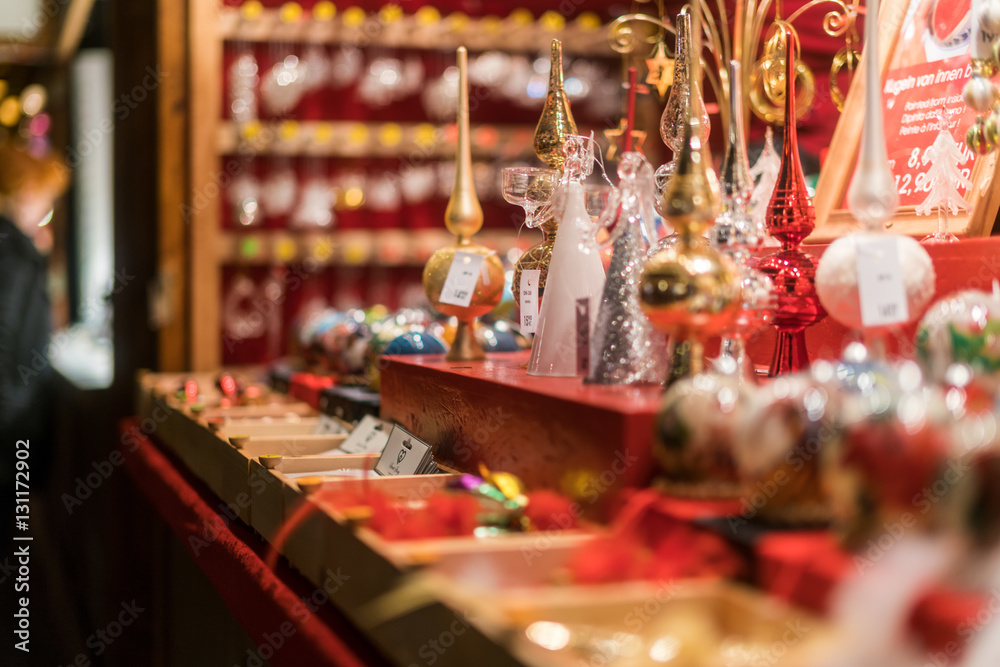 Handmade gold, silver and red tree decorations at busy Breitscheidplatz Christmas market