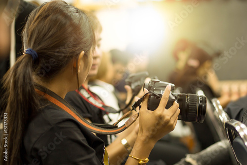 woman hand holding camera in workshop room