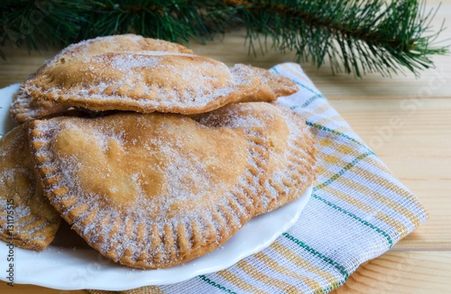 Trucha de batata, typical Christmas sweet in Canary Islands, Spain. Canary pastries traditionally filled with sweet potatoes paste or cabell d'angel. photo