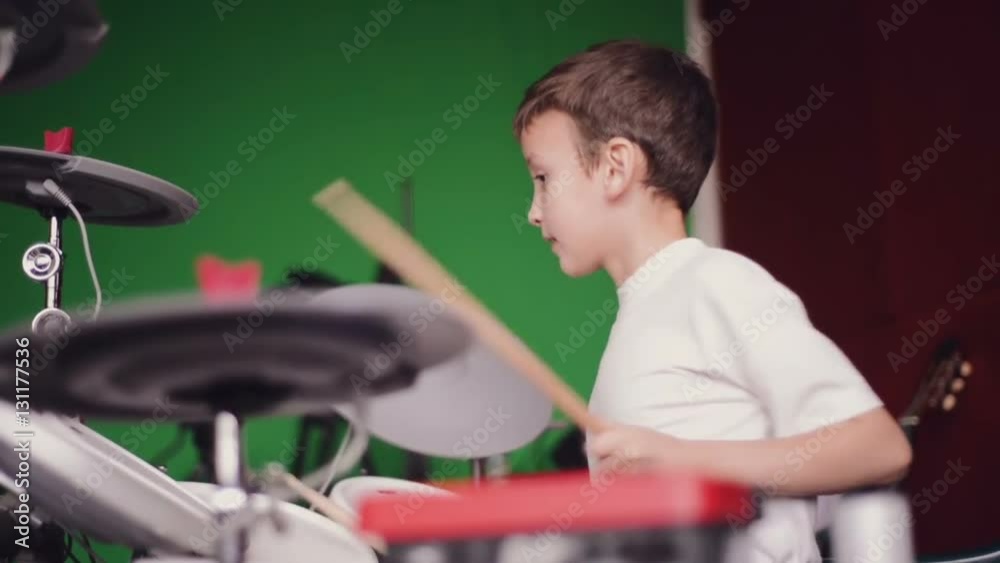 little boy playing electronic drums slow motion little boy playing electronic drums slow motion