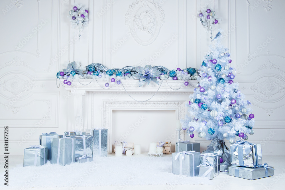 Christmas tree with presents underneath in living room