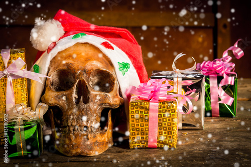 Still Life with human Skull in chrismas day on old wooden background photo