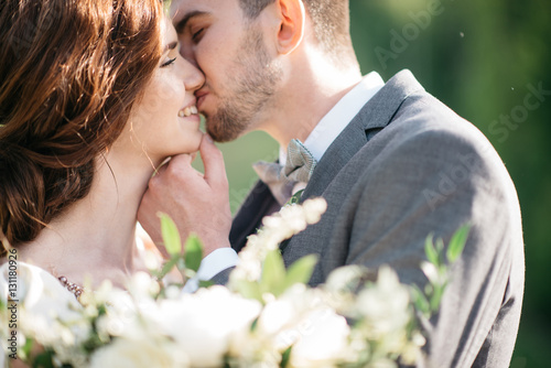 wedding couple hugging outdoors
