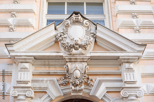 acroteria on the facade of white architectural building