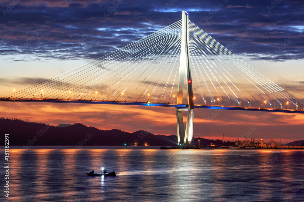 Obraz premium Iron bridge and fishing boat