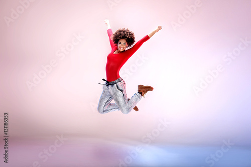 Young girl dancing, jumping. © neonshot