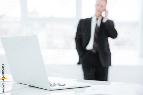 Blur image of business man talking at phone