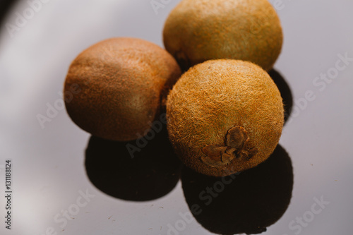 some fresh kiwi on a dark background close-up