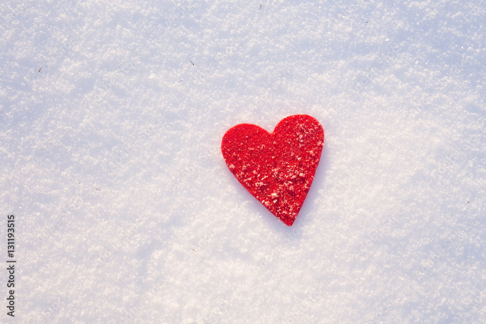 Red felt heart shape in snow, Valentine's Day. Copy space for text. Snowflakes on heart. Valentines day, love concept. White background Red felt heart shape in snow, Valentine's Day. Copy space for text. Snowflakes on heart. Valentines day, love concept. White background