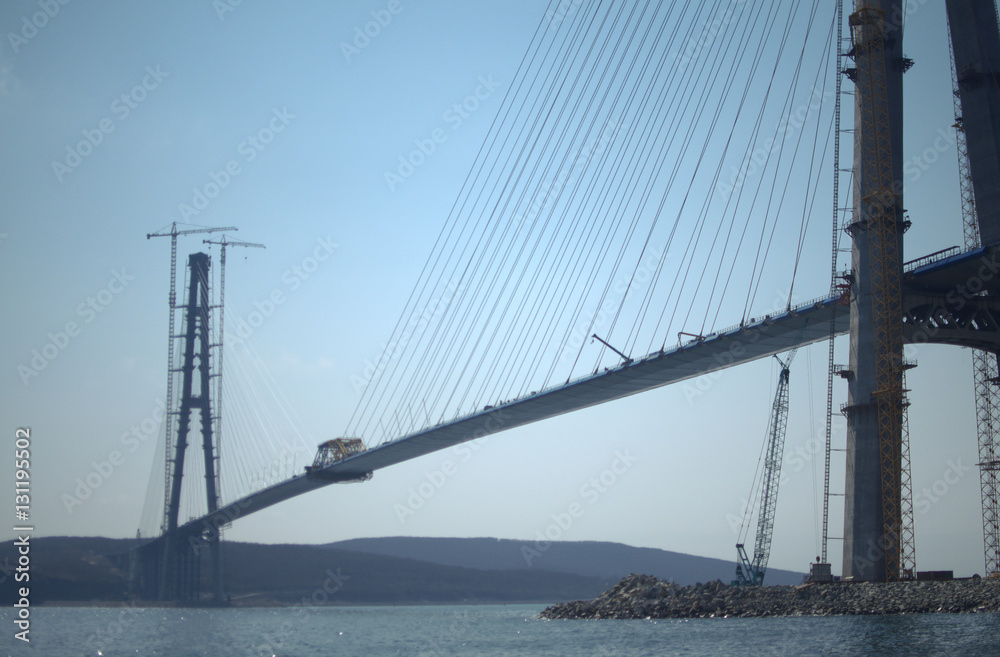 Construction of the cable-stayed bridge. Cable-stayed pylon in foreground