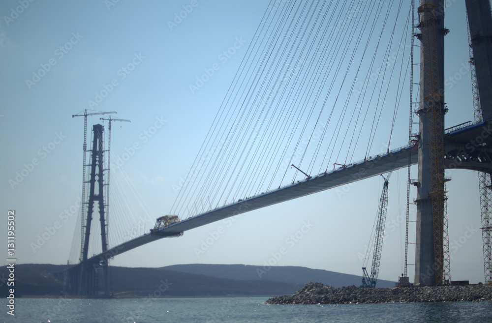 Construction of the cable-stayed bridge. Cable-stayed pylon in foreground Construction of the cable-stayed bridge. Cable-stayed pylon in foreground