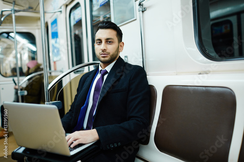 Typing in metro © pressmaster