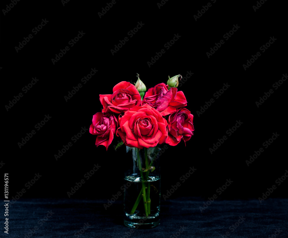 Bouquet of red roses in crystal glass on velvet textured table cloth.  Floral wallpaper Stock Photo | Adobe Stock