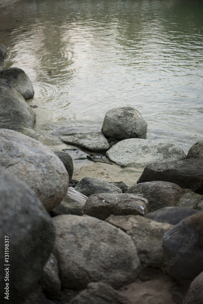 Fototapeta premium The river flows around stones