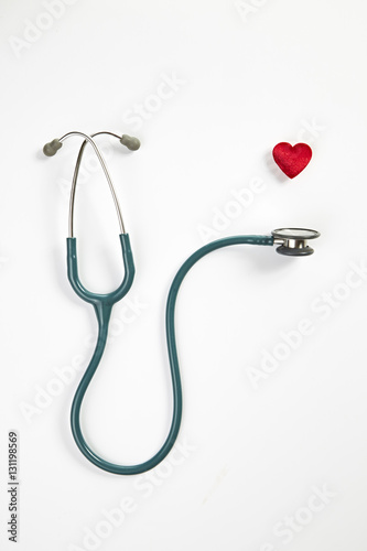 Red heart and stethoscope isolated on white background