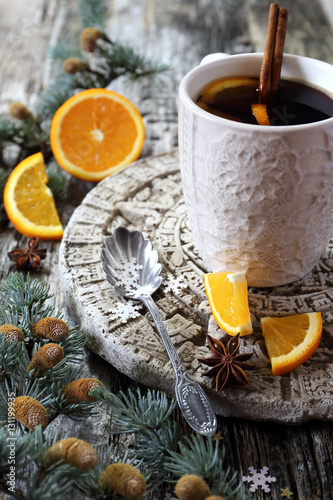Winter hot beverage with cinnamon and orange