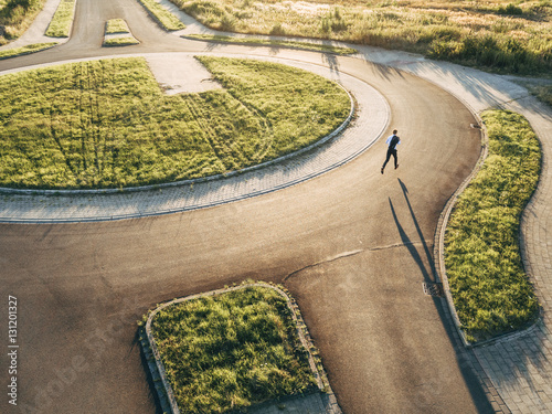 Businessman running in roundabout