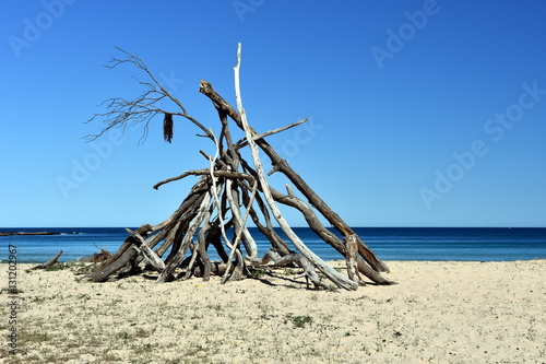 Hot dry Sunny day on Pebbly beach, NSW Australia. Branch hut on the South coast.